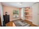Bedroom featuring natural light from a window, built-in storage, and hardwood floors at 6340 Nelms E Rd, Lakeland, FL 33811