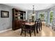 Cozy dining room featuring a classic hutch and bay windows with lovely views, ideal for Gathering meals at 6340 Nelms E Rd, Lakeland, FL 33811