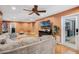 Large living room featuring a sectional sofa, a TV, and views into other rooms of the home at 6340 Nelms E Rd, Lakeland, FL 33811