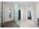 Modern bathroom featuring a walk-in shower with sleek gray tiling and a glass door at 8374 Bowden Way, Windermere, FL 34786