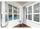 Bedroom with plantation shutters and view of the pool at 8374 Bowden Way, Windermere, FL 34786