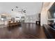 Spacious living area with hardwood floors, modern kitchen, and ample natural light at 8374 Bowden Way, Windermere, FL 34786