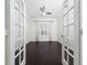 Home office with French doors, hardwood floors, and large window at 8374 Bowden Way, Windermere, FL 34786