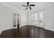 Home office featuring a ceiling fan, crown molding, and natural light from shuttered windows at 8374 Bowden Way, Windermere, FL 34786