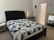 Bedroom featuring a bed with a patterned quilt and vanity with large mirror at 8907 Legacy Ct # 14 205, Kissimmee, FL 34747