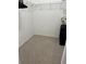 Simple walk in closet with wire shelving provides storage solutions at 8907 Legacy Ct # 14 205, Kissimmee, FL 34747