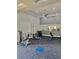 Functional community gym offering weight training equipment, exercise machines, mirrors and a ceiling fan at 8907 Legacy Ct # 14 205, Kissimmee, FL 34747