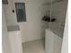 A laundry room equipped with a washer, dryer, and wire shelving at 8907 Legacy Ct # 14 205, Kissimmee, FL 34747