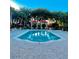 Inviting community pool with cabanas and lounge chairs surrounded by lush greenery at 8907 Legacy Ct # 14 205, Kissimmee, FL 34747
