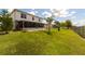 Expansive backyard featuring a screened lanai, lush lawn, and secure fencing, perfect for outdoor enjoyment at 905 Gloucester Ct, Kissimmee, FL 34758
