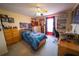 Bright bedroom with carpet, a ceiling fan, and plenty of personality at 905 Gloucester Ct, Kissimmee, FL 34758
