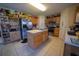 Spacious kitchen with a center island, stainless steel appliances, and ample cabinet space for storage at 905 Gloucester Ct, Kissimmee, FL 34758