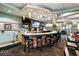Inviting community bar with comfortable seating, TVs, and a wide selection of beverages on display at 9075 Dogleg Dr, Davenport, FL 33896