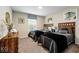 Bedroom featuring two twin beds, a dresser and large window at 9075 Dogleg Dr, Davenport, FL 33896