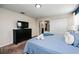 Bedroom featuring a TV, black dresser and a full size bed at 9075 Dogleg Dr, Davenport, FL 33896