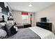 Bright bedroom with twin beds, themed art, and a dresser with a television at 9075 Dogleg Dr, Davenport, FL 33896