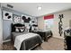 Spacious themed bedroom with a window and fun Mickey Mouse art and decor at 9075 Dogleg Dr, Davenport, FL 33896