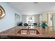 Kitchen island sink with granite countertop overlooking the open-concept living room at 9075 Dogleg Dr, Davenport, FL 33896