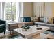 Comfortable living room with modern furniture and plenty of natural light at 9075 Dogleg Dr, Davenport, FL 33896