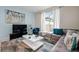 Cozy living room with comfortable seating and views of the screened-in patio at 9075 Dogleg Dr, Davenport, FL 33896