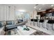 Open-concept living room and kitchen with modern finishes and stainless steel appliances at 9075 Dogleg Dr, Davenport, FL 33896
