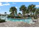 Zero entry pool with water slides and palm trees at 9075 Dogleg Dr, Davenport, FL 33896