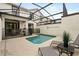 Screened-in pool and patio area featuring outdoor seating and a safety fence at 9075 Dogleg Dr, Davenport, FL 33896