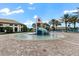 Community splash pad featuring colorful play structures and plenty of room for to have fun at 9075 Dogleg Dr, Davenport, FL 33896