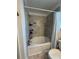 This bathroom boasts a tile shower and tub at 11312 Listening Dr, Orlando, FL 32832