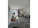 Bright bedroom featuring carpet flooring, a desk, and decorative items creating a cozy space at 11312 Listening Dr, Orlando, FL 32832