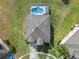 Aerial shot showcasing the home, its well-manicured lawn, and the surrounding neighborhood at 107 Troon Cir, Davenport, FL 33897