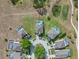 Aerial view of home with a private screened-in pool in a serene neighborhood at 107 Troon Cir, Davenport, FL 33897