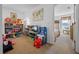 Bonus room or playroom with multiple TVs and a -size arcade game at 107 Troon Cir, Davenport, FL 33897