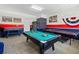 Spacious game room featuring a pool table, ping pong table, and fun decor for entertainment at 107 Troon Cir, Davenport, FL 33897