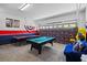 Versatile game room with a pool table and ping pong table, perfect for Gathering gatherings and leisure activities at 107 Troon Cir, Davenport, FL 33897