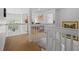 Second floor hallway landing with railing overlooking the main level below at 107 Troon Cir, Davenport, FL 33897