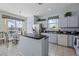 Kitchen with island and adjacent dining area, bright with natural light at 107 Troon Cir, Davenport, FL 33897
