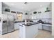 Kitchen with stainless steel appliances and breakfast bar at 107 Troon Cir, Davenport, FL 33897
