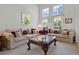 Bright living room features high ceilings and large windows, and traditional furniture at 107 Troon Cir, Davenport, FL 33897