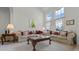 Bright living room features high ceilings and large windows, and traditional furniture at 107 Troon Cir, Davenport, FL 33897