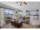 Open floor plan living room with neutral decor and view of the backyard at 107 Troon Cir, Davenport, FL 33897