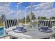 Covered outdoor dining space with an umbrella table set, perfect for enjoying refreshments by the pool at 107 Troon Cir, Davenport, FL 33897
