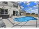 Sparkling pool with screened enclosure offers a relaxing outdoor space for recreation and entertaining at 107 Troon Cir, Davenport, FL 33897