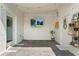 Covered patio with brick pavers, a wall-mounted TV, and decorative wall art, perfect for outdoor relaxation at 11473 Listening Dr, Orlando, FL 32832