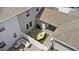 A backyard with an outdoor dining area, a lounge area, and artificial grass at 11473 Listening Dr, Orlando, FL 32832