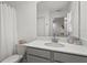 Bright bathroom featuring a white vanity, a mirror, and modern fixtures at 11473 Listening Dr, Orlando, FL 32832