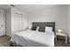 This bedroom features neutral walls, soft lighting, and a stylish gray tufted headboard at 11473 Listening Dr, Orlando, FL 32832