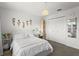 Stylish bedroom with a cozy bed, closet, vanity, and decor creates a relaxing retreat at 11473 Listening Dr, Orlando, FL 32832