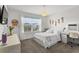 Bright bedroom with a large window, vanity, and flower decor creates a serene and inviting atmosphere at 11473 Listening Dr, Orlando, FL 32832