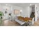 Open dining area with modern table and chairs, adjacent to staircase and front entrance at 11473 Listening Dr, Orlando, FL 32832